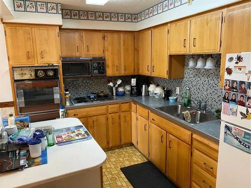 5120 46 Avenue, Spirit River, AB - Indoor Photo Showing Kitchen With Double Sink