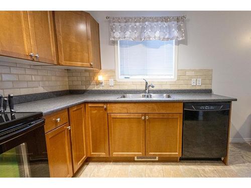 126-9105 91St, Grande Prairie, AB - Indoor Photo Showing Kitchen With Double Sink