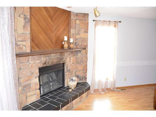 4429 54 Street, Grimshaw, AB - Indoor Photo Showing Living Room With Fireplace