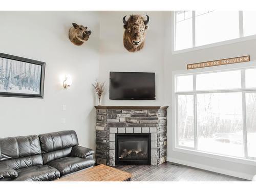 33039 Twp Rd 725, Bezanson, AB - Indoor Photo Showing Living Room With Fireplace