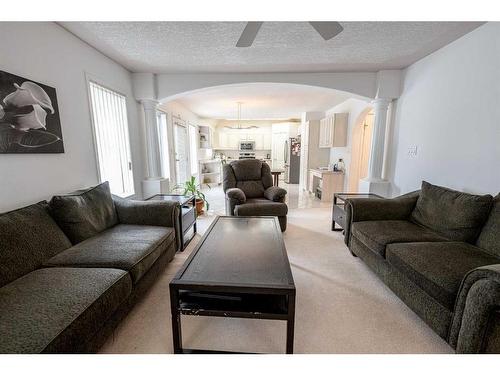 6122 98 Street, Grande Prairie, AB - Indoor Photo Showing Living Room With Fireplace