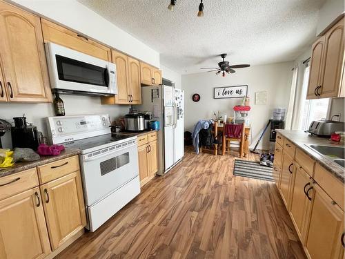 10825 95 Street, Grande Prairie, AB - Indoor Photo Showing Kitchen With Double Sink