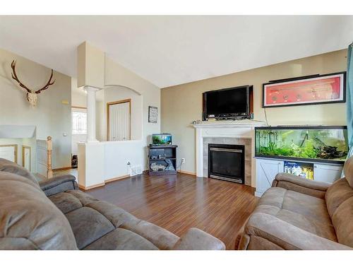 13 Pinnacle Street, Grande Prairie, AB - Indoor Photo Showing Living Room With Fireplace
