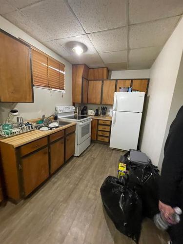 5839 49 Street, High Prairie, AB - Indoor Photo Showing Kitchen With Double Sink