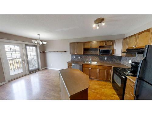 10306 70 Avenue, Grande Prairie, AB - Indoor Photo Showing Kitchen With Double Sink