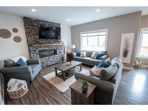 7466 91 Street, Grande Prairie, AB - Indoor Photo Showing Living Room With Fireplace