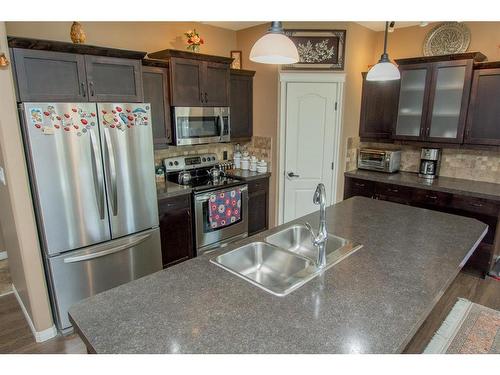 8833 73 Avenue, Grande Prairie, AB - Indoor Photo Showing Kitchen With Stainless Steel Kitchen With Double Sink