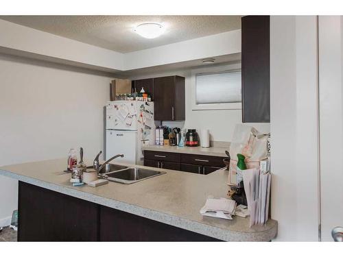 9615 113 Avenue, Clairmont, AB - Indoor Photo Showing Kitchen With Double Sink