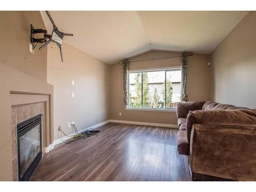 11826 86A Street, Grande Prairie, AB - Indoor Photo Showing Living Room With Fireplace