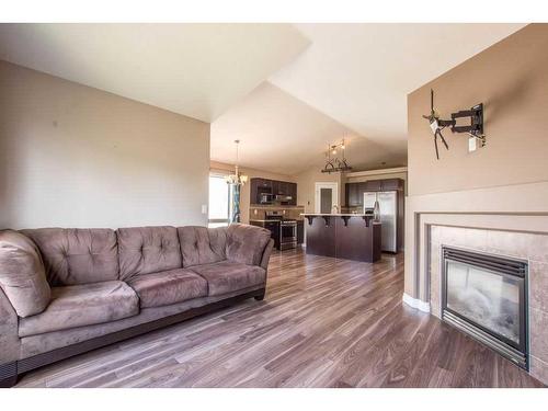 11826 86A Street, Grande Prairie, AB - Indoor Photo Showing Living Room With Fireplace