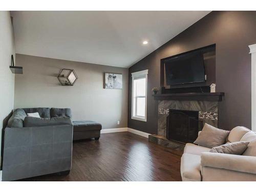7518 115B Street, Grande Prairie, AB - Indoor Photo Showing Living Room With Fireplace