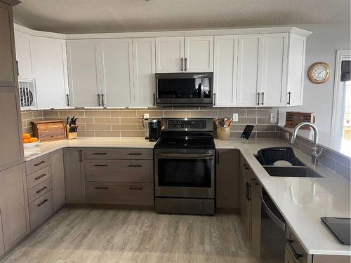 10510 90 Street, Peace River, AB - Indoor Photo Showing Kitchen With Double Sink