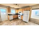 6915 112 Street, Grande Prairie, AB  - Indoor Photo Showing Kitchen With Double Sink 