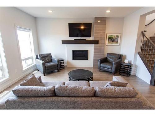 8522 71A Avenue, Grande Prairie, AB - Indoor Photo Showing Living Room With Fireplace