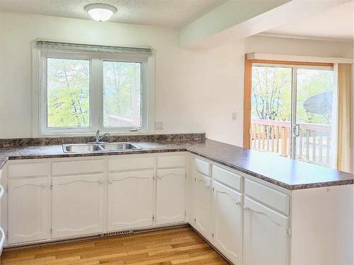 10429 Hoppe Avenue, Grande Cache, AB - Indoor Photo Showing Kitchen With Double Sink