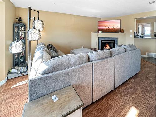 17 Pinnacle Boulevard, Grande Prairie, AB - Indoor Photo Showing Living Room With Fireplace
