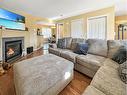 17 Pinnacle Boulevard, Grande Prairie, AB  - Indoor Photo Showing Living Room With Fireplace 