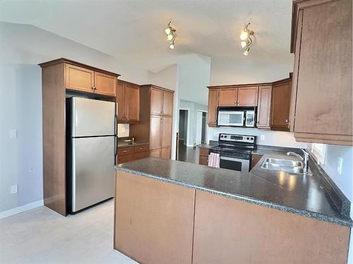13-131 Moberly Road, Grande Cache, AB - Indoor Photo Showing Kitchen With Double Sink