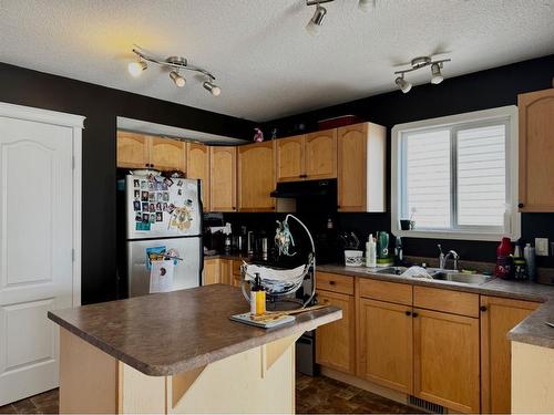 9009 93 Avenue, Grande Prairie, AB - Indoor Photo Showing Kitchen With Double Sink