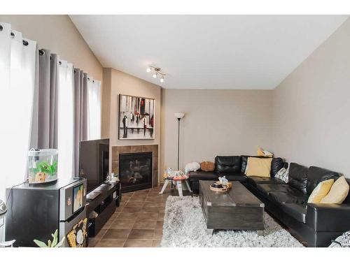 11033 67 Avenue, Grande Prairie, AB - Indoor Photo Showing Living Room With Fireplace