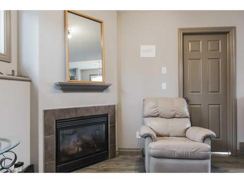 11033 67 Avenue, Grande Prairie, AB - Indoor Photo Showing Living Room With Fireplace