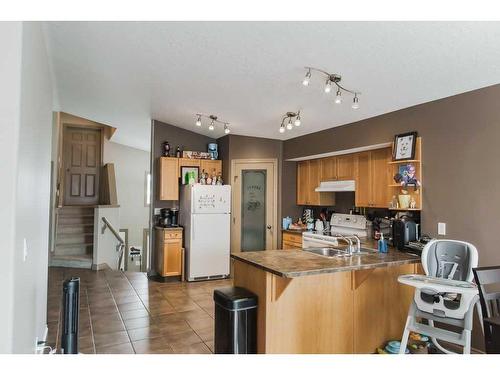 11033 67 Avenue, Grande Prairie, AB - Indoor Photo Showing Kitchen With Double Sink