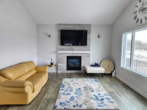 6038 114A Street, Grande Prairie, AB - Indoor Photo Showing Living Room With Fireplace