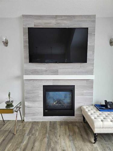 6038 114A Street, Grande Prairie, AB - Indoor Photo Showing Living Room With Fireplace