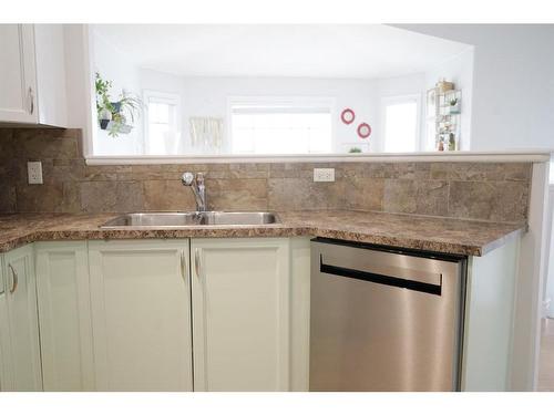 7114 114 Street, Grande Prairie, AB - Indoor Photo Showing Kitchen With Double Sink