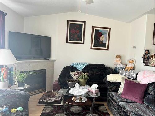 116 Shepherds Way, Valleyview, AB - Indoor Photo Showing Living Room With Fireplace