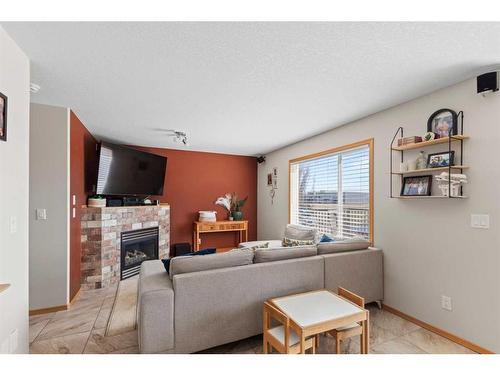 10741 72 Avenue, Grande Prairie, AB - Indoor Photo Showing Living Room With Fireplace