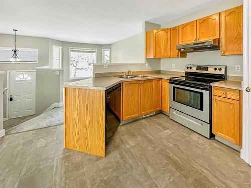 10429 Kateri Drive, Grande Prairie, AB - Indoor Photo Showing Kitchen With Double Sink