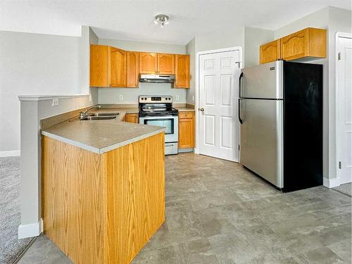 10429 Kateri Drive, Grande Prairie, AB - Indoor Photo Showing Kitchen With Double Sink