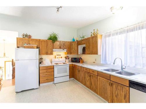 9310 70A Avenue, Grande Prairie, AB - Indoor Photo Showing Kitchen With Double Sink