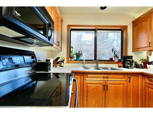 7213 96 Street, Peace River, AB - Indoor Photo Showing Kitchen With Double Sink