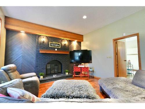 7213 96 Street, Peace River, AB - Indoor Photo Showing Living Room With Fireplace