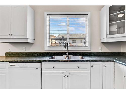 12010 88A Street, Grande Prairie, AB - Indoor Photo Showing Kitchen With Double Sink