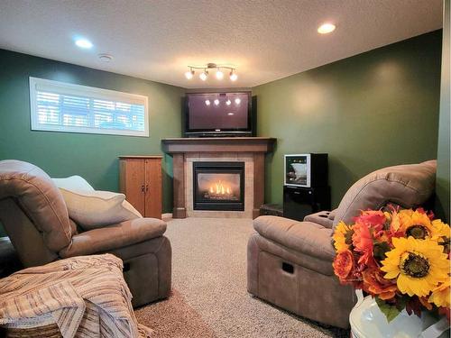 11110 O'Brien Lake Drive, Grande Prairie, AB - Indoor Photo Showing Living Room With Fireplace