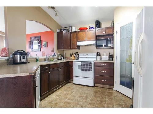 8846 69 Avenue, Grande Prairie, AB - Indoor Photo Showing Kitchen With Double Sink