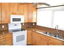 9621 83 Avenue, Peace River, AB  - Indoor Photo Showing Kitchen With Double Sink 