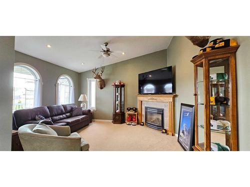 121 Sunset Drive, Spirit River, AB - Indoor Photo Showing Living Room With Fireplace