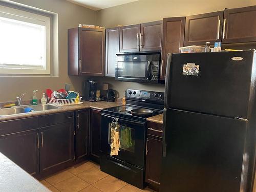 7434 89 Street, Grande Prairie, AB - Indoor Photo Showing Kitchen With Double Sink