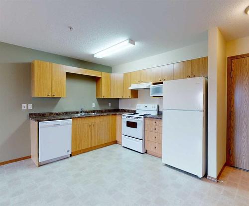 206 ,300, 302-12015 Royal Oaks Drive, Grande Prairie, AB - Indoor Photo Showing Kitchen With Double Sink