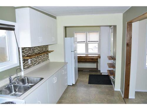 117 1St Avenue, Falher, AB - Indoor Photo Showing Kitchen With Double Sink