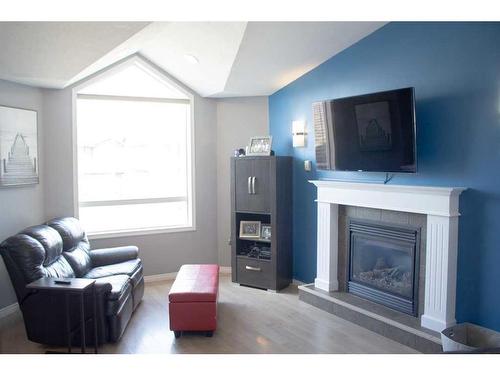 62 Pinnacle Lake Drive, Grande Prairie, AB - Indoor Photo Showing Living Room With Fireplace