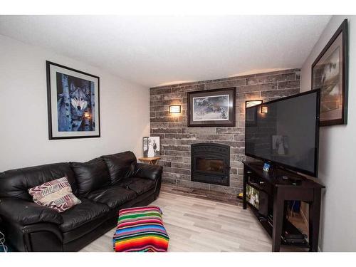 6409 96 Street, Grande Prairie, AB - Indoor Photo Showing Living Room With Fireplace