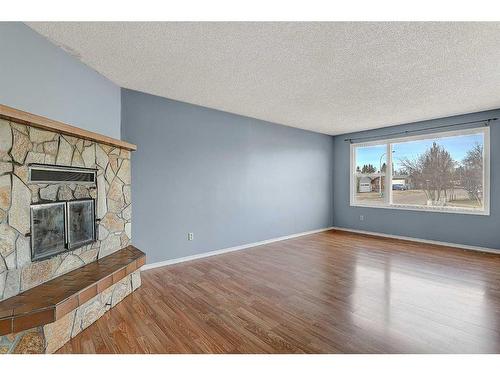 12401 94A Street, Grande Prairie, AB - Indoor Photo Showing Living Room With Fireplace