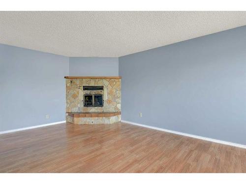 12401 94A Street, Grande Prairie, AB - Indoor Photo Showing Living Room With Fireplace