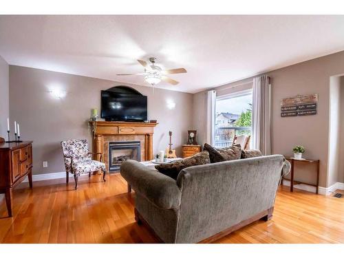6026 87 A Street, Grande Prairie, AB - Indoor Photo Showing Living Room With Fireplace
