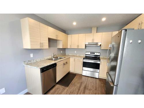 11428 106 Avenue, Grande Prairie, AB - Indoor Photo Showing Kitchen With Stainless Steel Kitchen With Double Sink